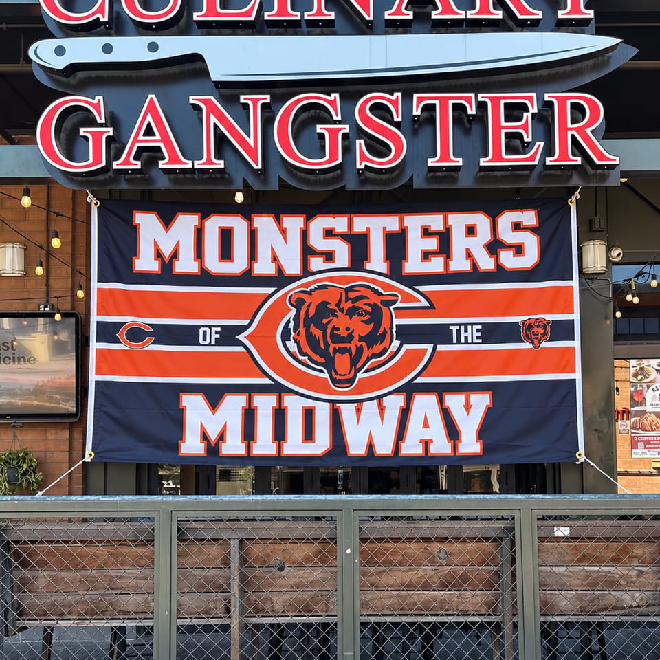 Culinary Gangster sign and Chicago Bears banner at the Tempe location